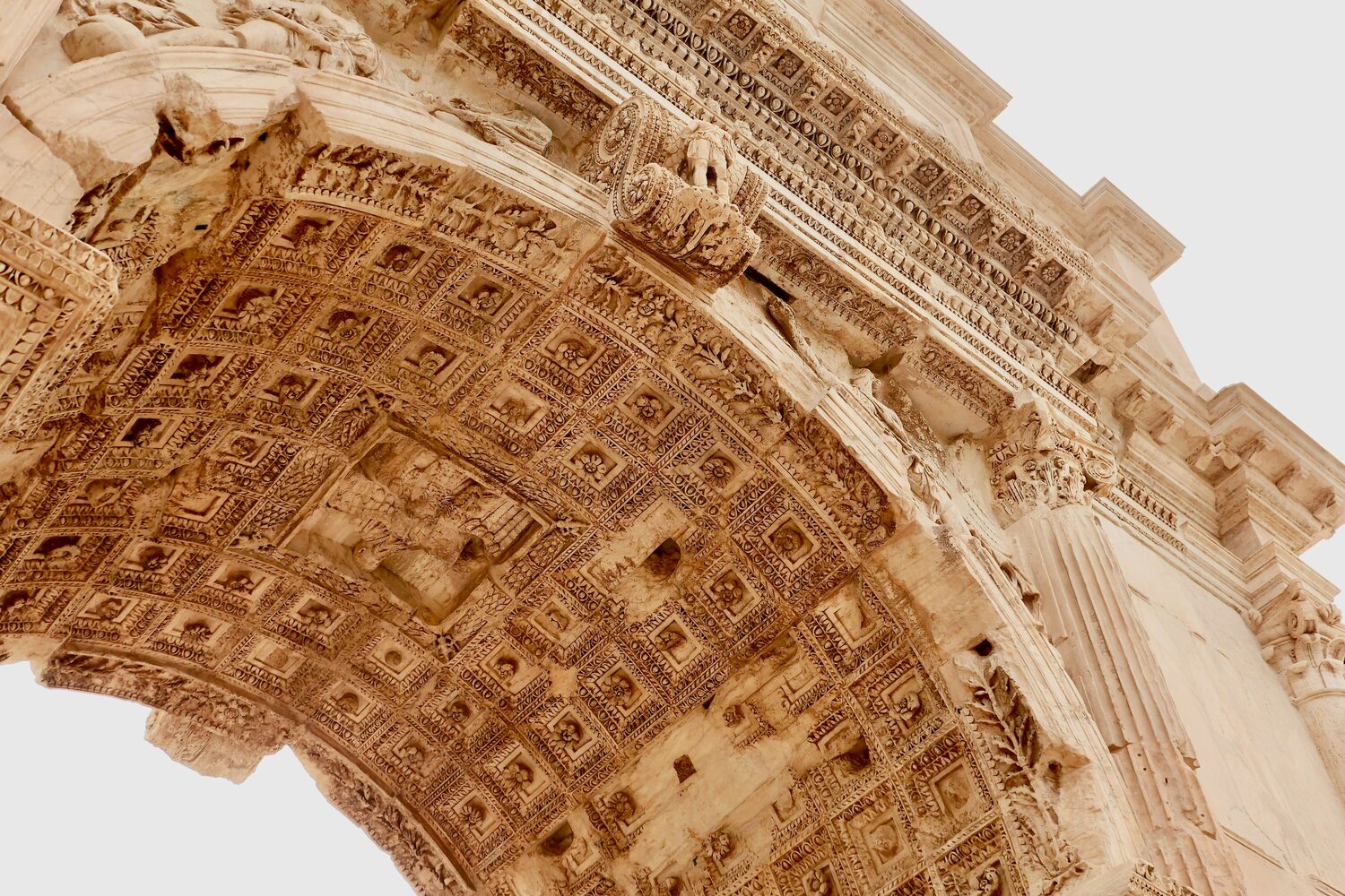 The coffered vault of the Arch of Titus: the ceiling of a triumph, carved on the inside where only the procession beneath it would ever look up.